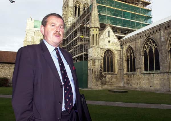 Mick Shone photographed outside Chichester Cathedral in 2005