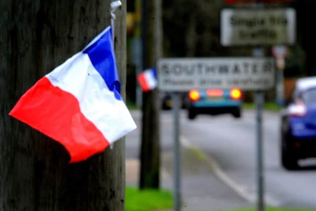 French flags have been placed along Worthing Road, Southwater. Pic Steve Robards SR1525950 SUS-151116-164349001