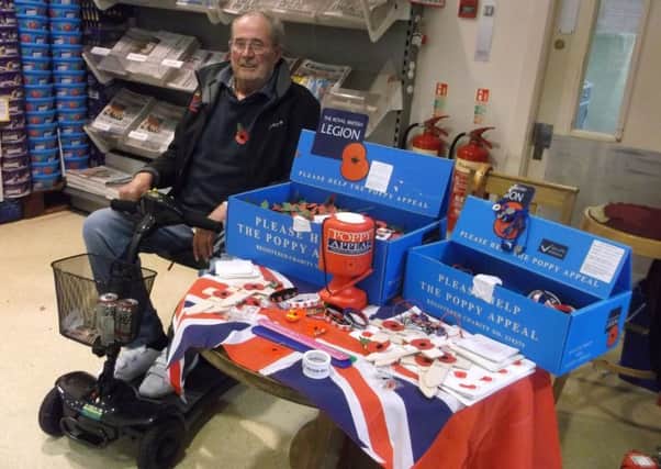 Royal British Legion Peasmarsh branch chairman Tony Curd manning the poppy appeal at Jempson's