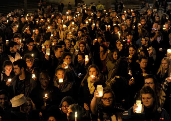 Hundreds gather across the world to pay their respects to the victims of the Paris terror attacks. Picture: Sarah Standing (151890-1618) PPP-151116-213204001