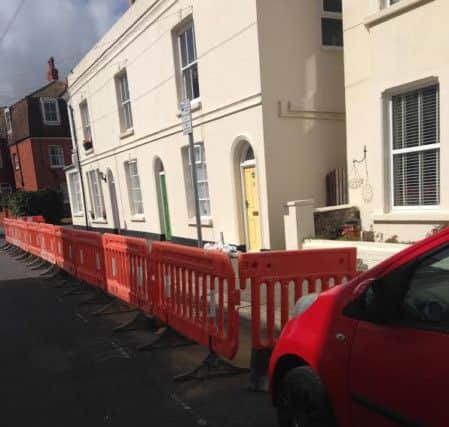 Barriers block off parking bays in Brunswick Road, Worthing SUS-151117-171139001