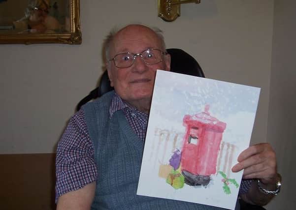 Horsham-vbased Westlake House care home resident David Bower with his Christmas card design SUS-151127-144827001