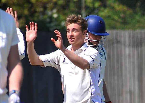 Nick Oxley celebrates a wicket while playing for Worthing Cricket Club during their   title-winning season this year