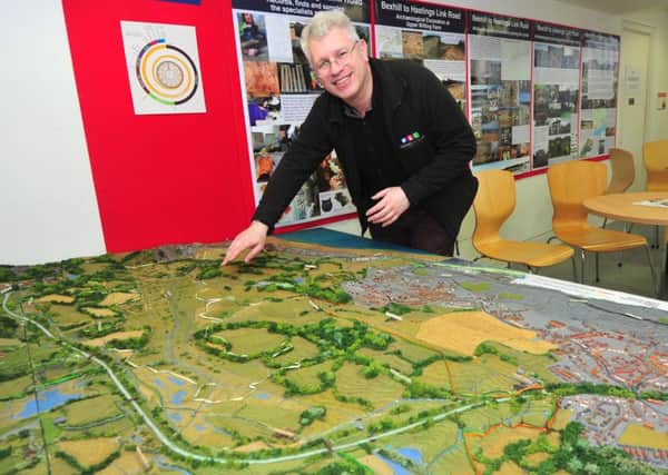10/2/15- Bexhill Museum Curator Julian Porter with the museum's scale model of the Bexhill to Hastings Link Road. SUS-151002-164742001
