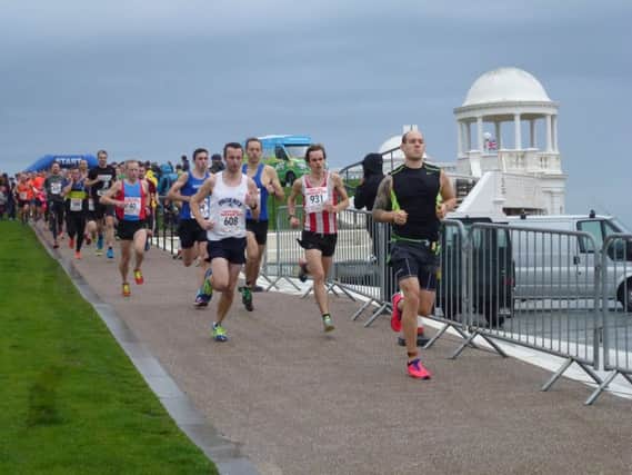Runners head off in the Poppy Half Marathon. Picture by Simon Newstead (SUS-150811-103458002)