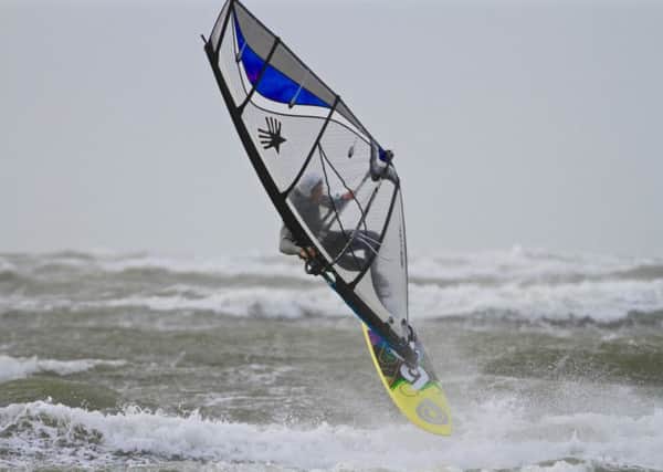 Local windsurfer Mark Perry enjoying the stormy conditions at West Wittering beach. Picture by Simon Bassett/2XS