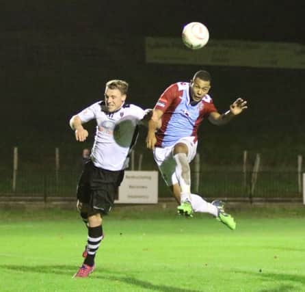 Jack Harris goes up for a header during Hastings United's 2-1 defeat at home to Merthyr Town on Tuesday night. Picture courtesy Scott White