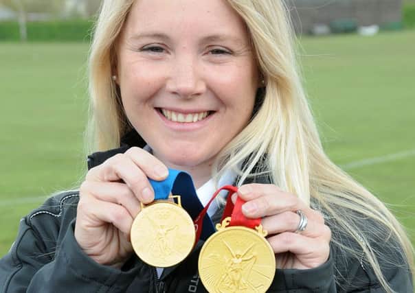 Sarah Ayton with two of her medals
