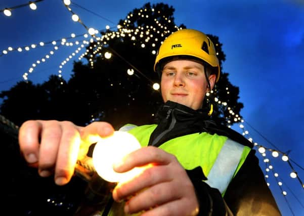 Arborist George Morris performs a final lights check on the UK tallest Christmas tree at Wakehurst Place Ardingly, Pic Steve Robards SR1526204 SUS-151121-132103001