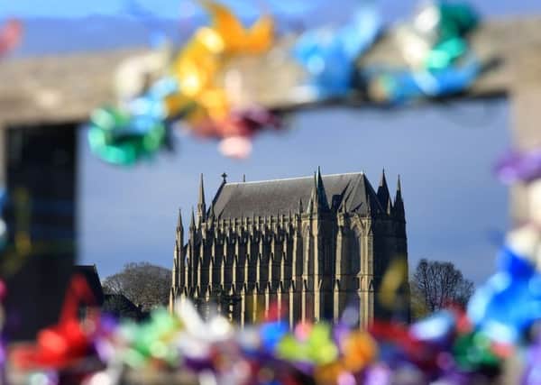 A view of Lancing College Chapel seen through tributes left on the Old Shoreham Tollbridge, near the A27. PRESS ASSOCIATION photo. Gareth Fuller/PA Wire