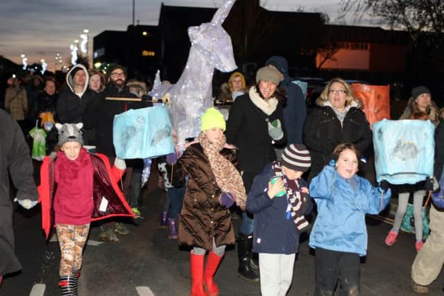 Giant animals helped to light up the parade through Lancing dm15227699a