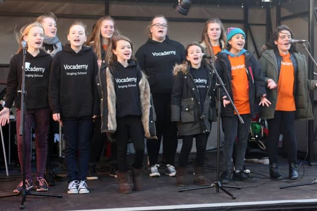 DM15227339a Vocademy Singing School performing in Montague Street