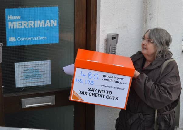 38 Degrees' Sally Goring handed in the signatures to Huw Merriman's office today