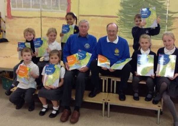 Storrington First School receive a donation from Chanctonbury Lions Club SUS-151125-113331001