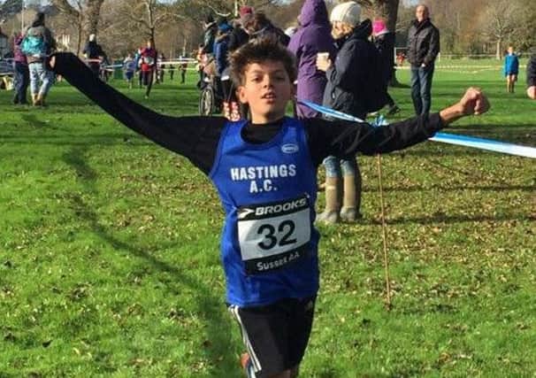 Jonas Judah, of Hastings Athletic Club, crosses the line to win the under-11 race at Bexhill Down on Saturday. Picture courtesy Terry Skelton
