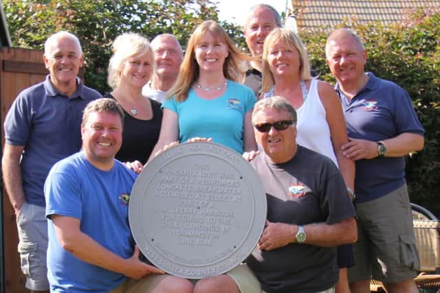 Members holding the plaque during Selsey Lifeboat Day