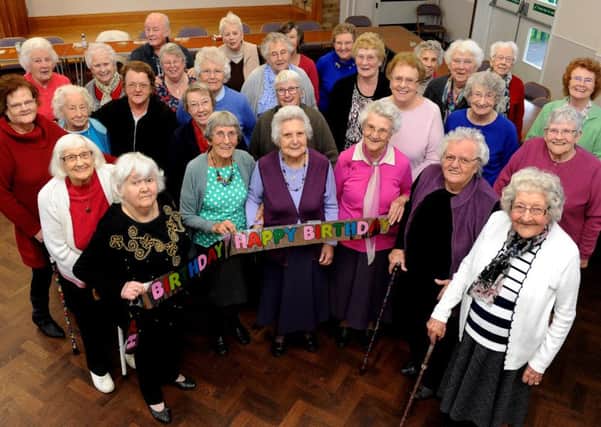 Members at the Parklands Thursday Club celebrate the 100th birthday of Doris Wyatt, third from left at front PICTURE BY STEVE ROBARDS