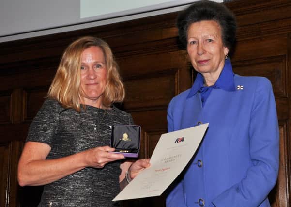 Sarah Eggleton receives her award from The Princess Royal, Princess Anne