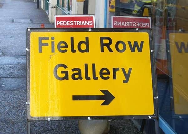 Signs pointing people in the direction of Field Row Gallery in Worthing - though the owner says the diversions are misleading SUS-151127-124317001
