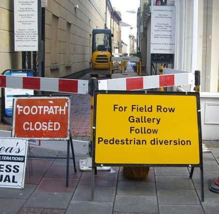 Signs pointing people in the direction of Field Row Gallery in Worthing - though the owner says the diversions are misleading