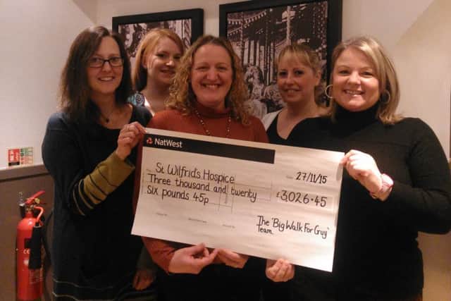 The team with the cheque for £3,026.45
