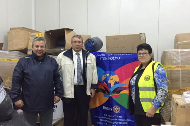 Professor Grigoris Grtigoropoulos, governor for Rotary's Southern Greece District, Koropi Rotarian Maria Mastora and Lesvos vice-mayor Nikolaos Karasavvas in the warehouse