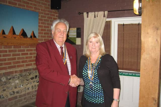West Worthing Rotary Club president Dr Sue Virgo and Littlehampton Rotary Club president Mike Findlay shake on the agreement