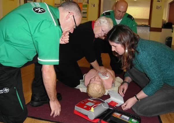 'Demystifying defibrillators' in Southwick - Pictured are from left Alan Lupton - volunteer, Liz Farrow - Croquet Club, Pete Bennett - volunteer,
Kate Gieler from the Horticultural Society, Country Market, Aspire, WSCC Library Services