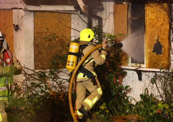 Firefighters tackling a blaze at a derelict building in Lancing.
