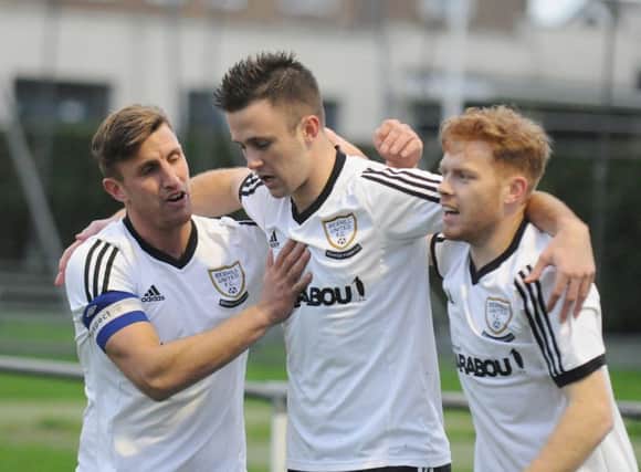 Jack Aston (left), Dan Cruikshank (centre) and Nathan Tudor (right) celebrate a Bexhill United goal during the 6-1 victory over Steyning Town last weekend. Picture courtesy Jon Smalldon