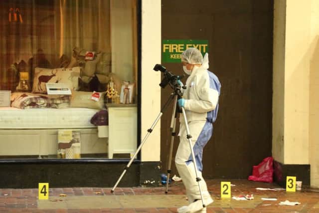 Forensic experts took photographs of the scene. Pictures by Eddie Mitchell