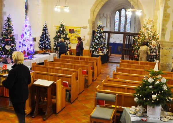 Some of the 21 trees on show at St John the Baptist Church, Findon, said to be one of the best yet