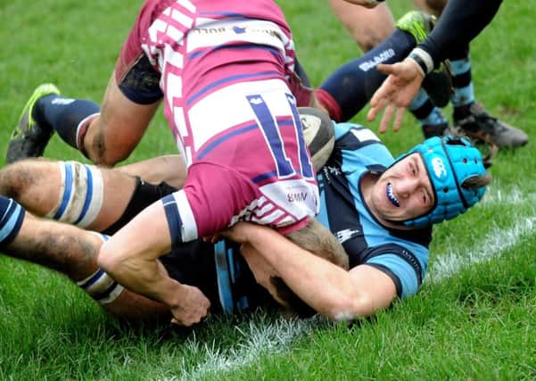 Alex Grace is wrestled to the floor in Chichester's clash with Shelford / Picture by Steve Robards