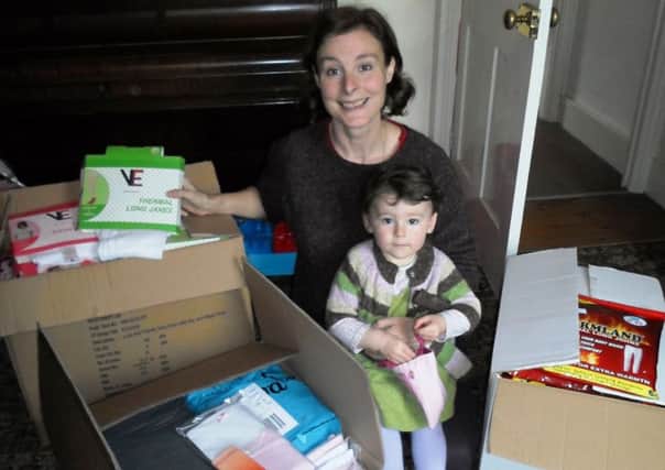 Isabel Woods from Handcross is collecting donations to buy Thermal underwear and hats, scarves and gloves for refugees in the Calais Jungle, Balkans and Serbia, Picture with her daughter Rose - picture submitted