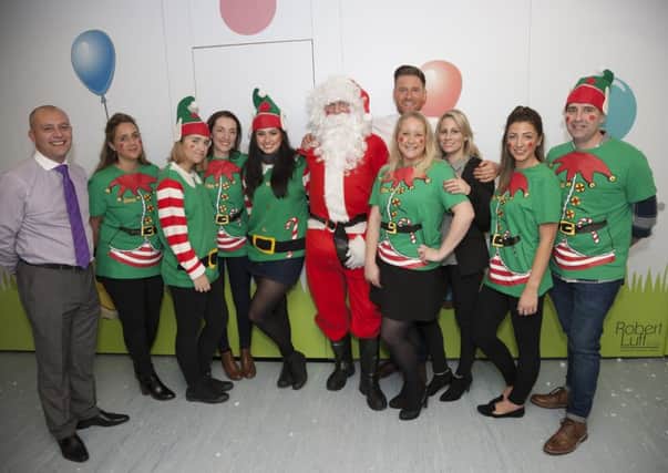 Estate agent Robert Luff and the team who performed a 'DIY SOS' at Kamelia Kids