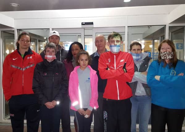 Broadbridge Heath Leisure Centre athletes, parents of users, and coaches. L-R Jade Lally, Dave Ingram, Elspeth Turner, Melanie Anning, Cleo Tomlinson, Keith May, Calum Neil, Keren Hannyngton, Kim Milnthorpe. Several are wearing gags as they were not given a slot to speak by HDC