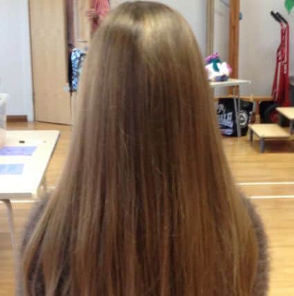 The full extent of Maisy's hair, which she looked after well before the cut
