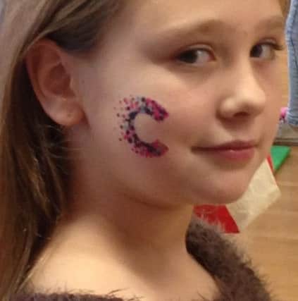 Sporting the Cancer Research logo for her fundraising effort