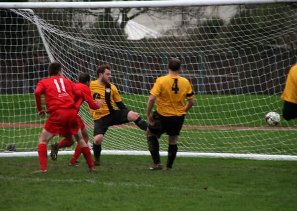 Bosham score their second at Worthing Leisure / Picture by Richard Evea