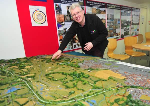 Bexhill Museum curator Julian Porter with the museum's scale model of the Bexhill to Hastings Link Road.