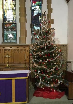 The beautifully-decorated tree in St Mary Magdalene Church