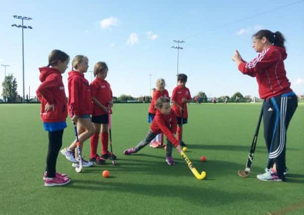 Wendy Russell in action on the hockey pitch