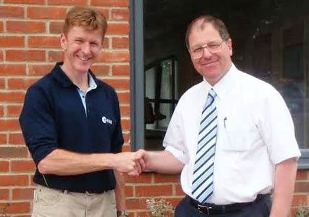 Major Tim Peake and his former physics teacher, Mike Gouldstone, at Chichester High School for Boys in 2009 SUS-151215-092648001