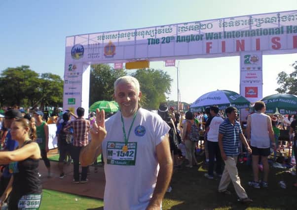 Guy Burridge after completing the Angkor Wat International Half Marathon