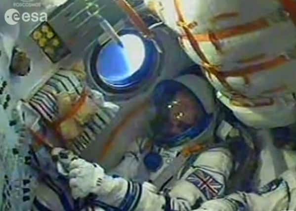 Screen grabbed image taken from footage issued by the European Space Agency of Major Tim Peake (left) blasting off into orbit on board the Soyuz space capsule. Photo: European Space Agency/PA Wire