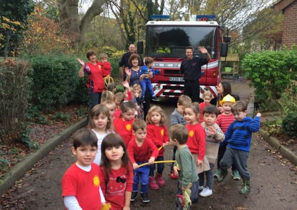 Firemen at St Andrews pre-school in Steyning SUS-151215-150350001