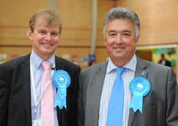 Neil Parkin, right, and other Adur members receive less than colleagues in Worthing. Worthing councillor Paul Yallop is pictured left