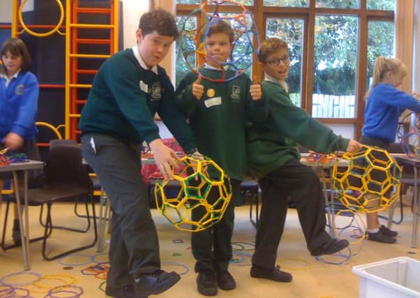 Edmund, William and Adam take part in a Royal Institution Mathematics Masterclass at ?their school - ?Bury Primary SUS-151215-153353001