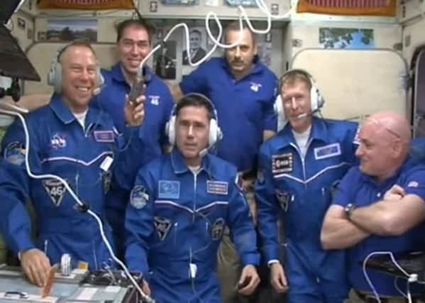 The crew aboard the International Space Station, including Major Tim Peake, second from the right