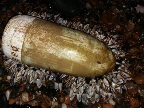 Sally Baker took this picture of the unexploded bomb on East Worthing beach this morning. SUS-151216-092031001